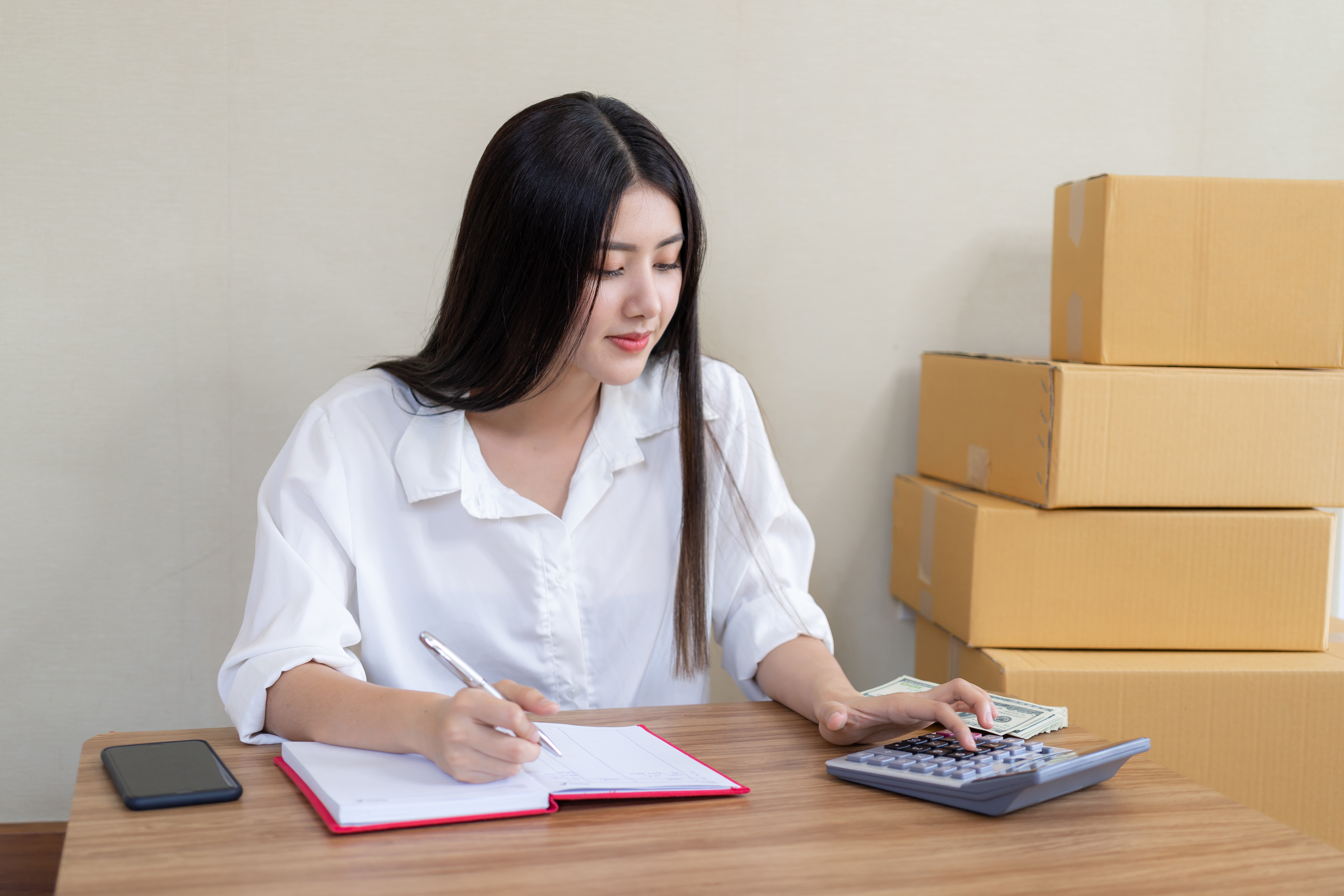 beautiful-asian-business-young-woman-fell-happy-after-ordering-product